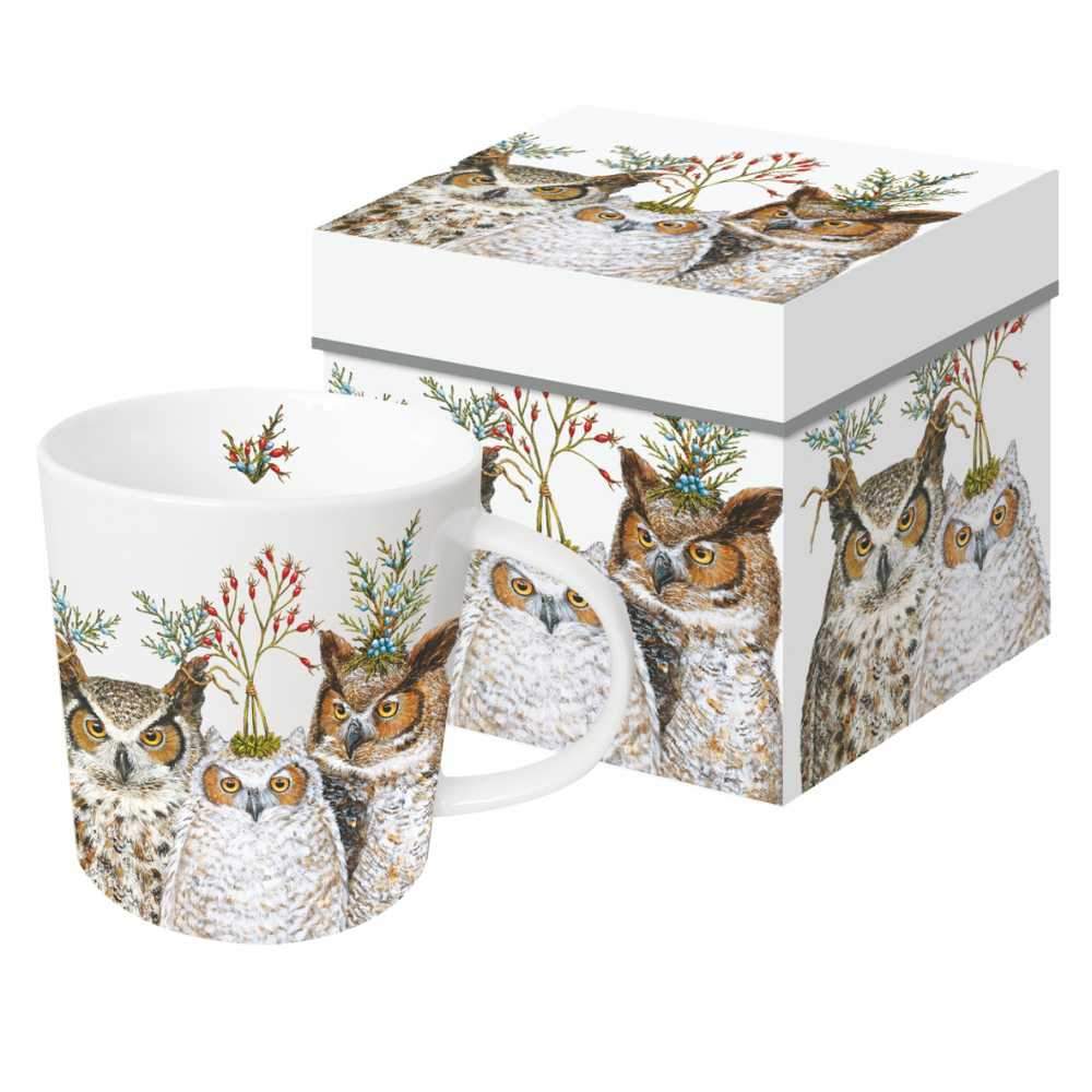A ceramic mug with a Christmas-themed design of owls and holiday foliage, presented in a matching decorative gift box. Art by Vicki Sawyer.