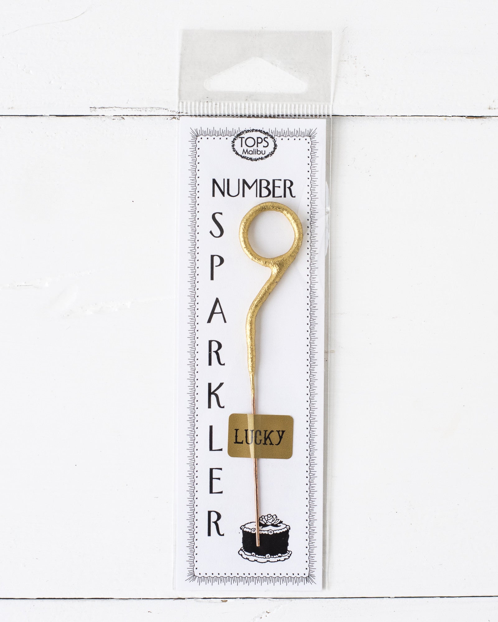 A 4" tall Gold Number Cake Topper Sparkler from Tops Malibu that instantly brings the party.