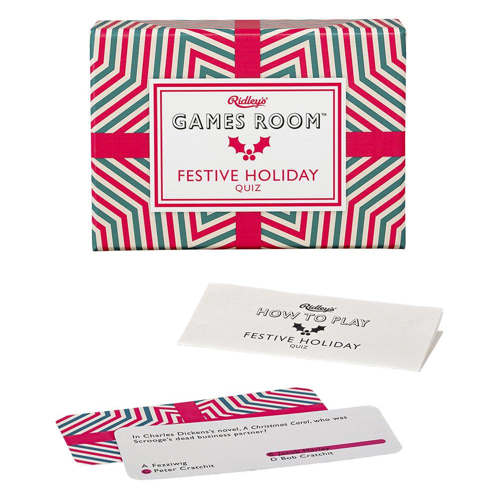 Festive Trivia Game box with sample question in front of it. 