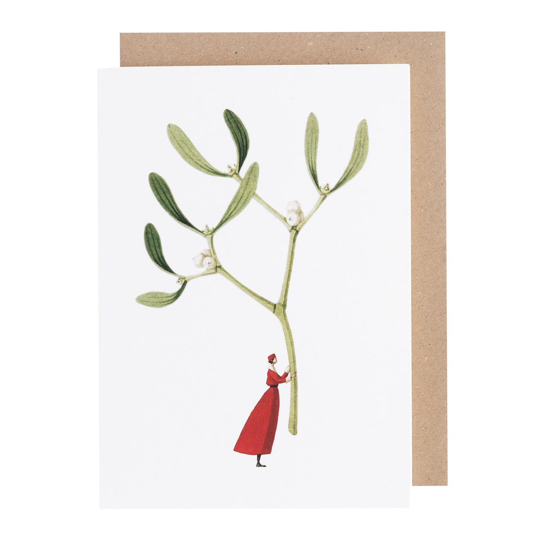A white greeting card featuring a whimsical illustration of a small woman in a red dress holding up a gigantic sprig of mistletoe by the stem. Kraft paper envelope included.