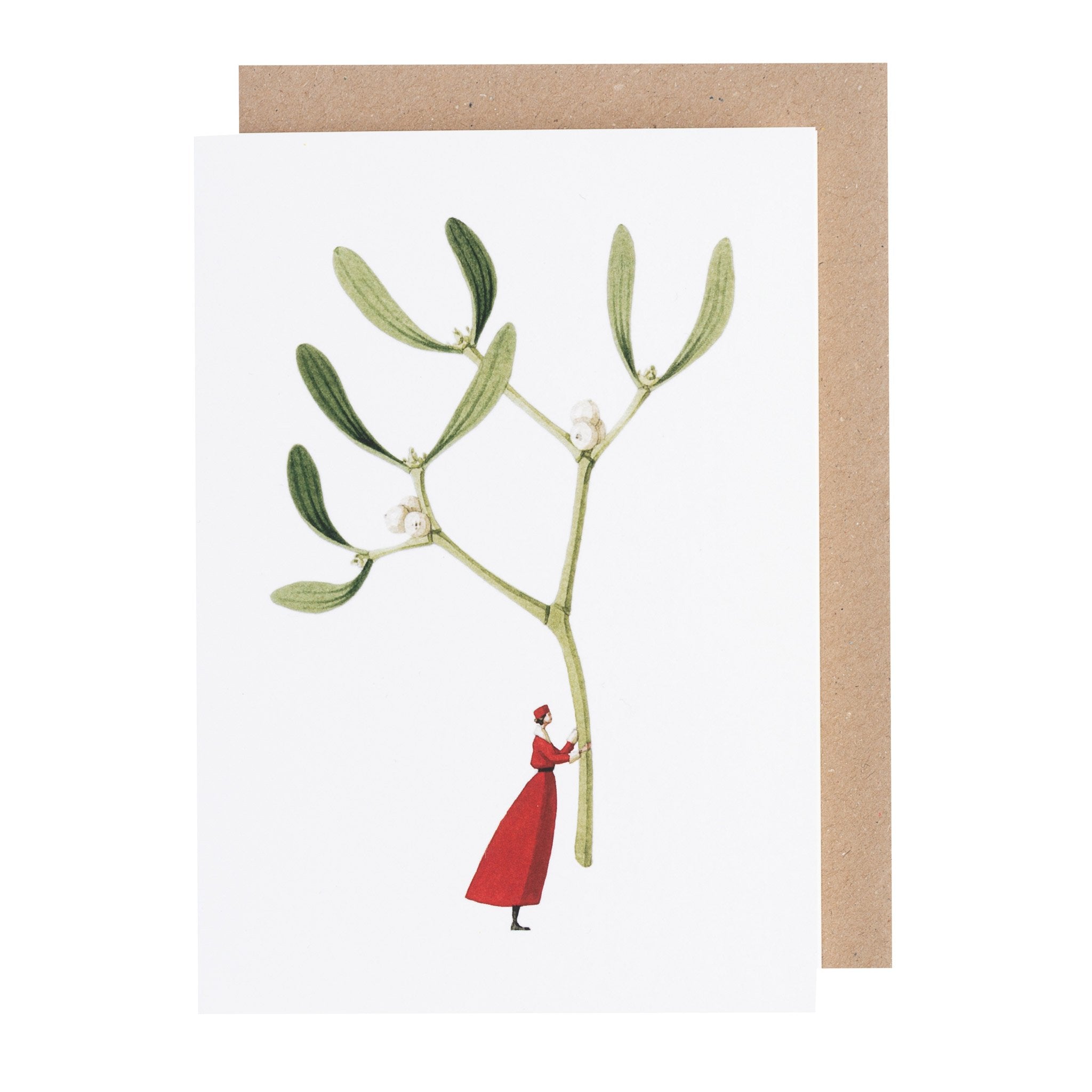 A white greeting card featuring a whimsical illustration of a small woman in a red dress holding up a gigantic sprig of mistletoe by the stem. Kraft paper envelope included.