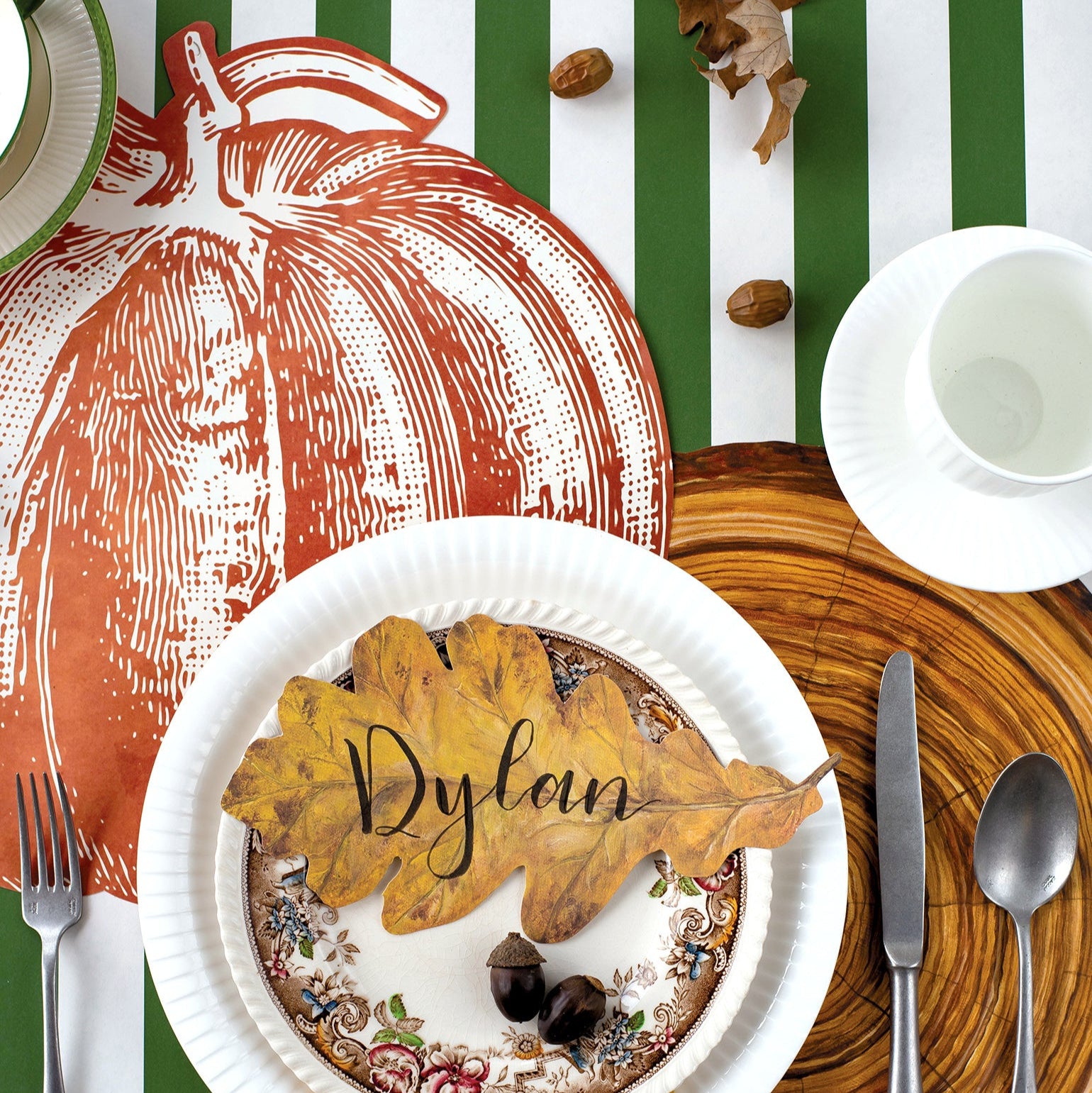 The Die-cut Pumpkin Placemat under an elegant fall-themed place setting, from above.