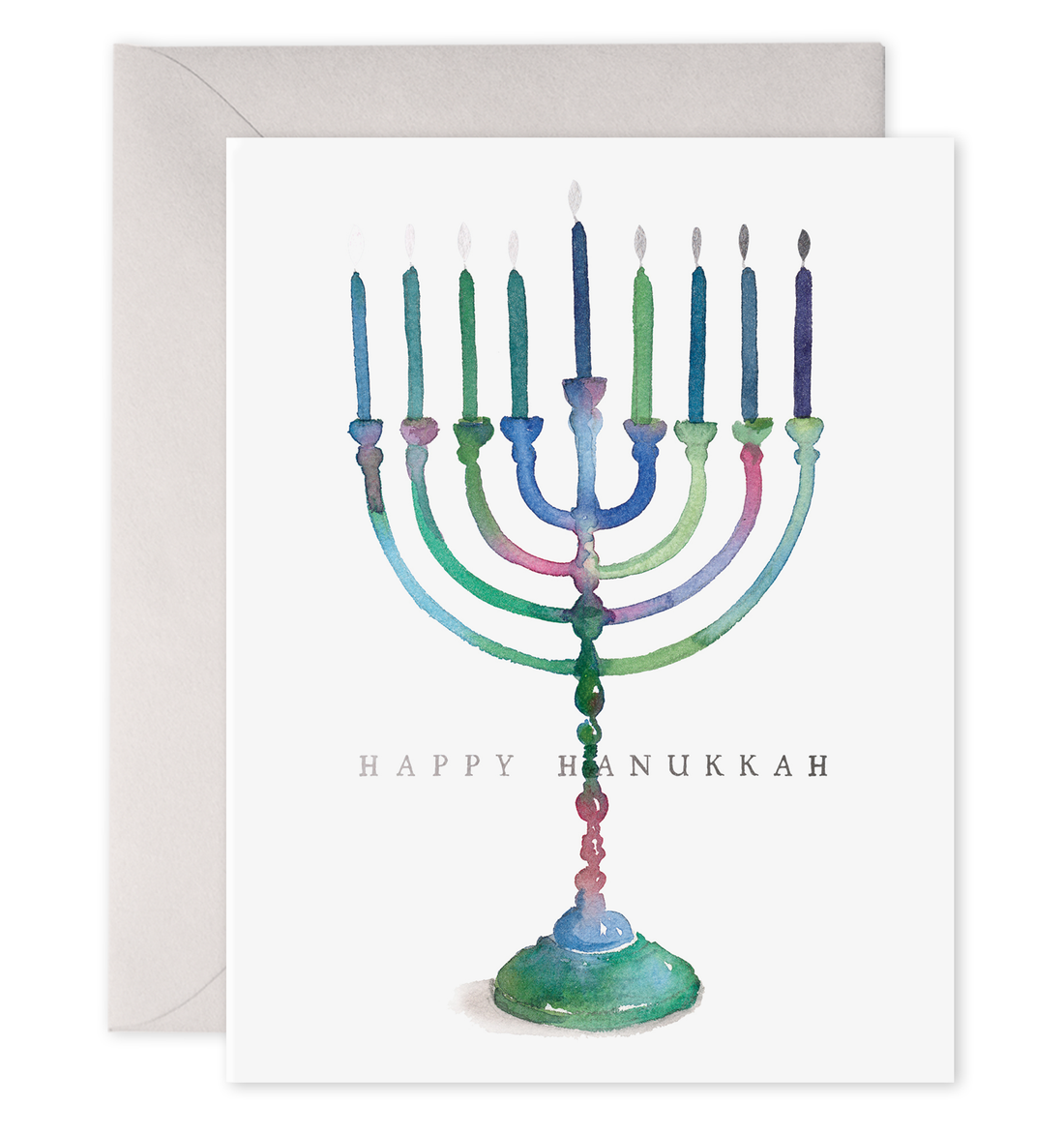 Front of card with illustration of a menorah on it in blues and greens saying &quot;Happy Hanukkah&quot; in silver foil