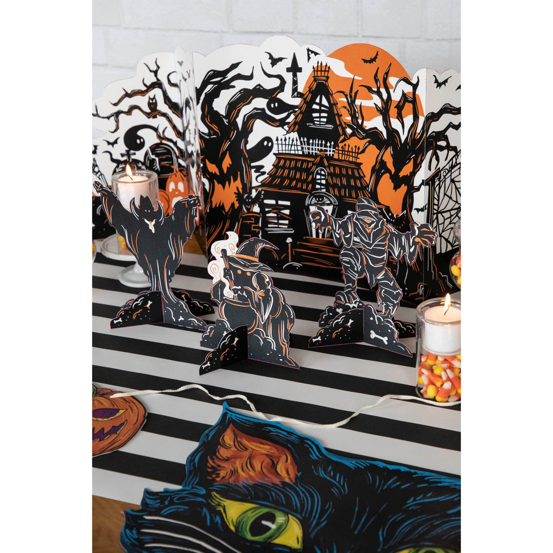 Three Monster Mash Table Ornaments, depicting spooky creatures, on a white background by Hester &amp; Cook.