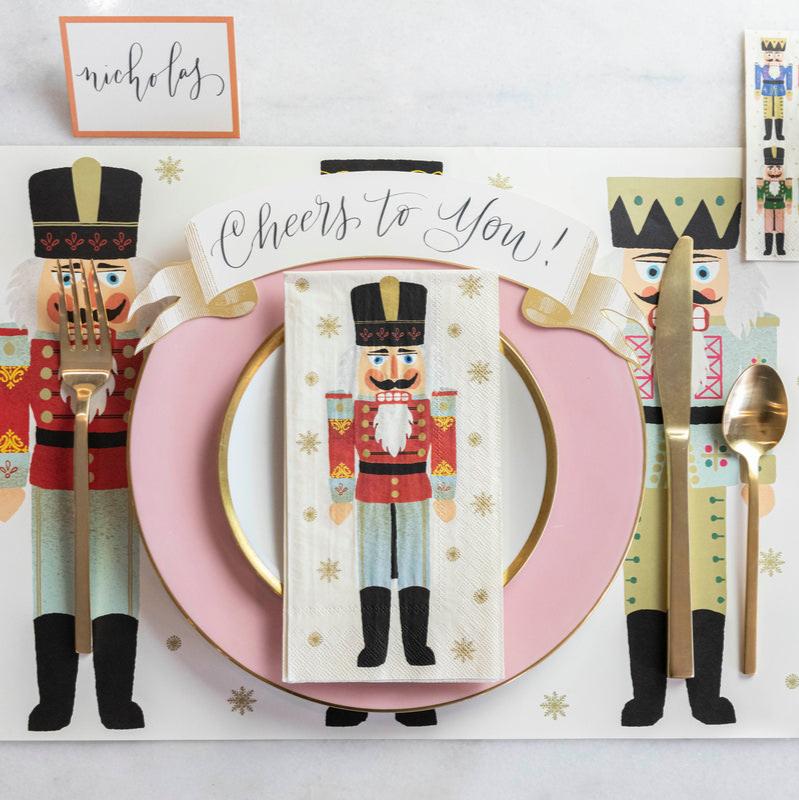 The Nutcrackers Placemat under a festive holiday place setting, from above.