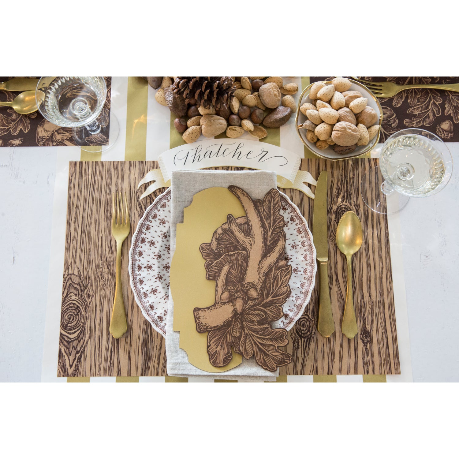 Top-down view of a rustic place setting featuring an Antler Table Accent resting on the plate.