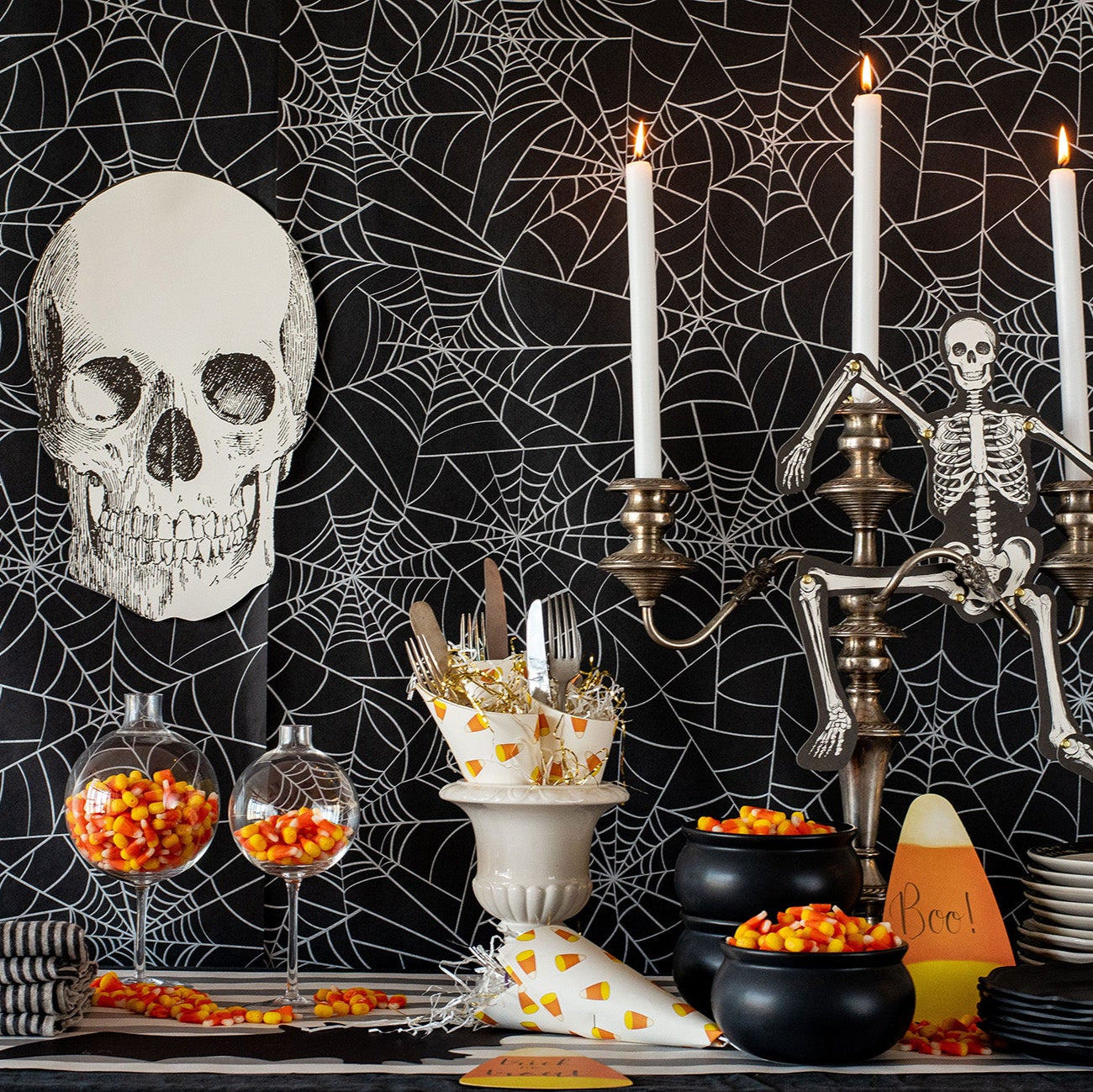 The Die-cut Skull Placemat used as decoration for a Halloween treat table.