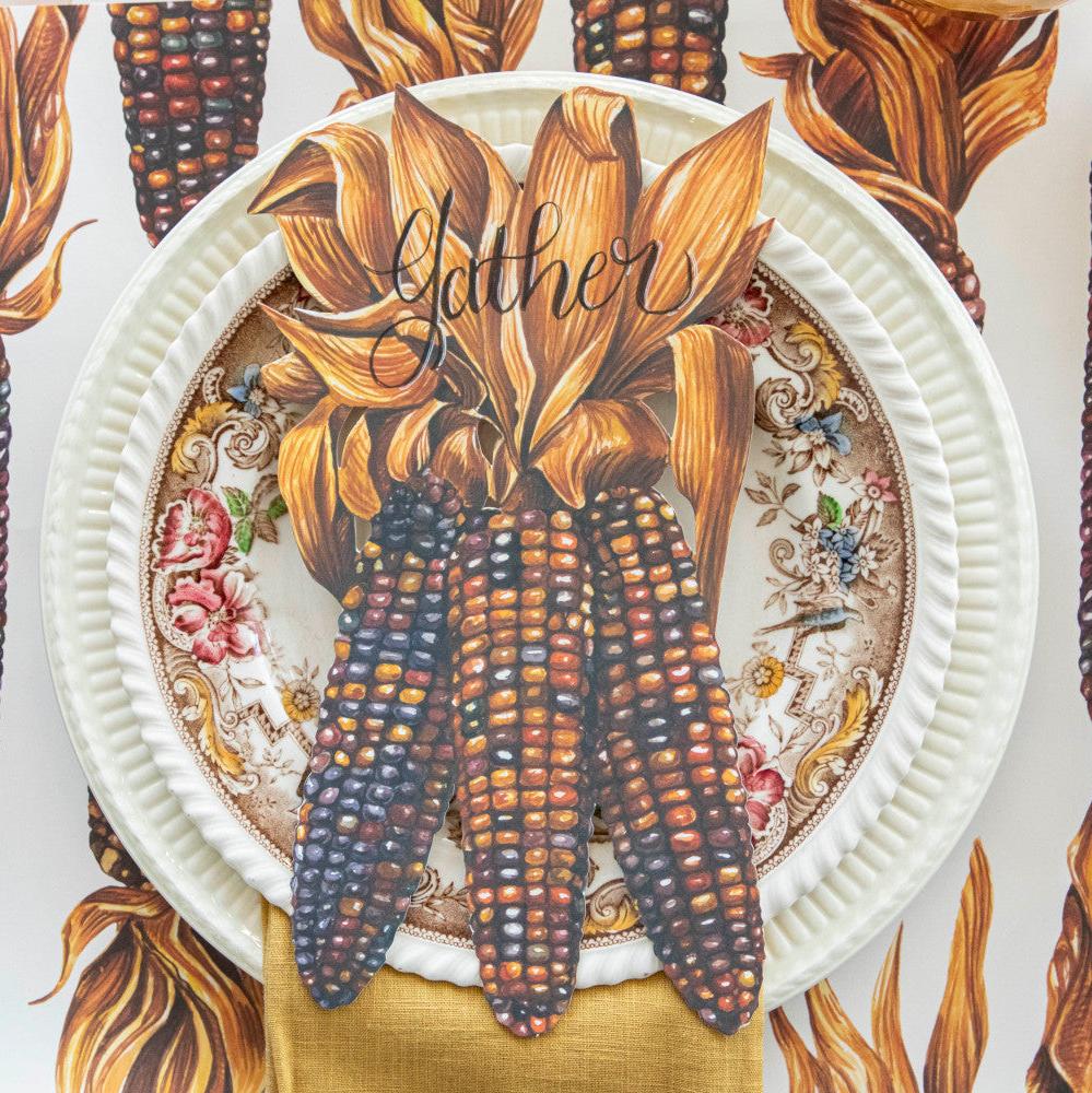 Illustration of colorful Hester & Cook Maize Table Accent with husks as a fall table accent.