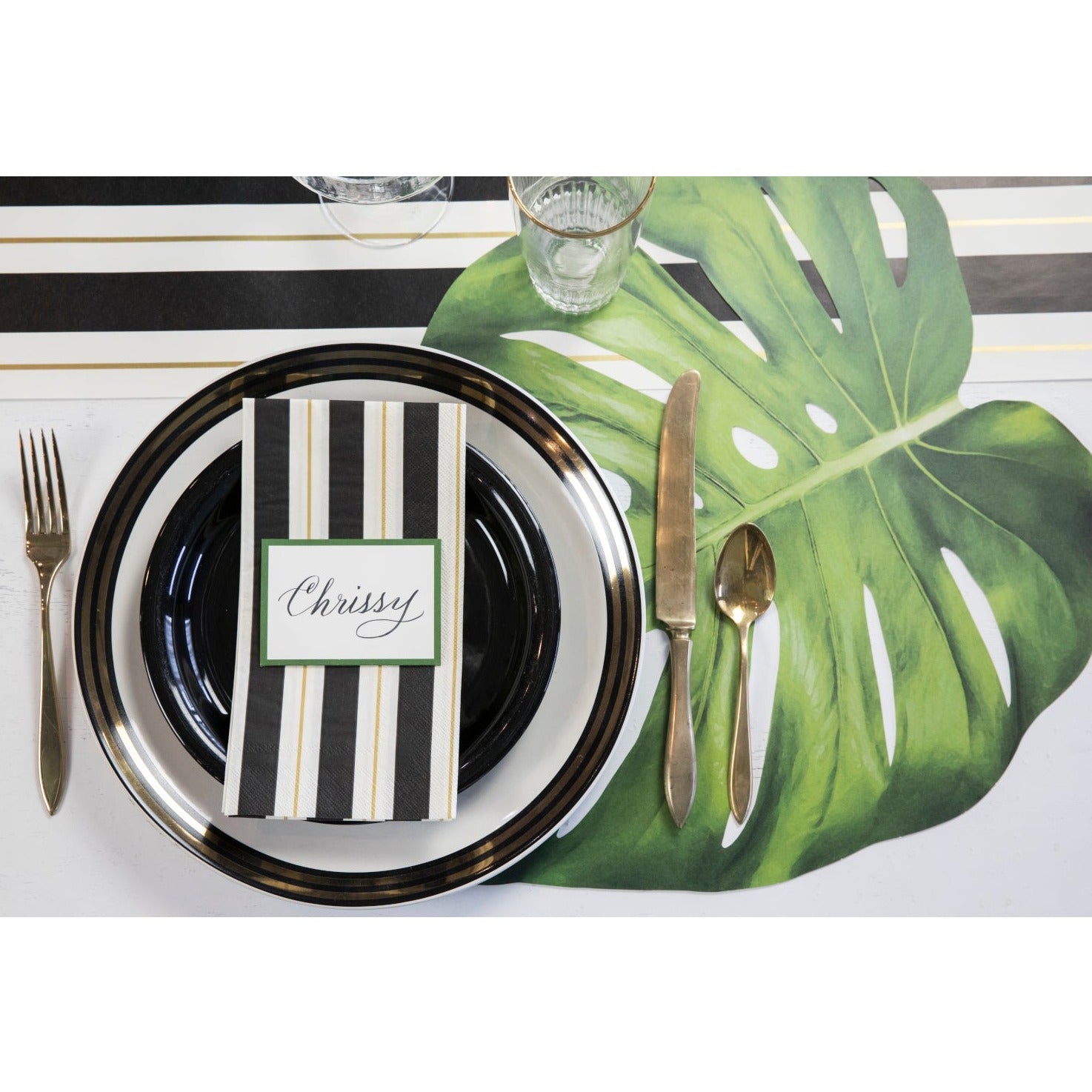 An elegant table setting featuring a Die-cut Monstera Placemat from Hester & Cook as a stylish touch.