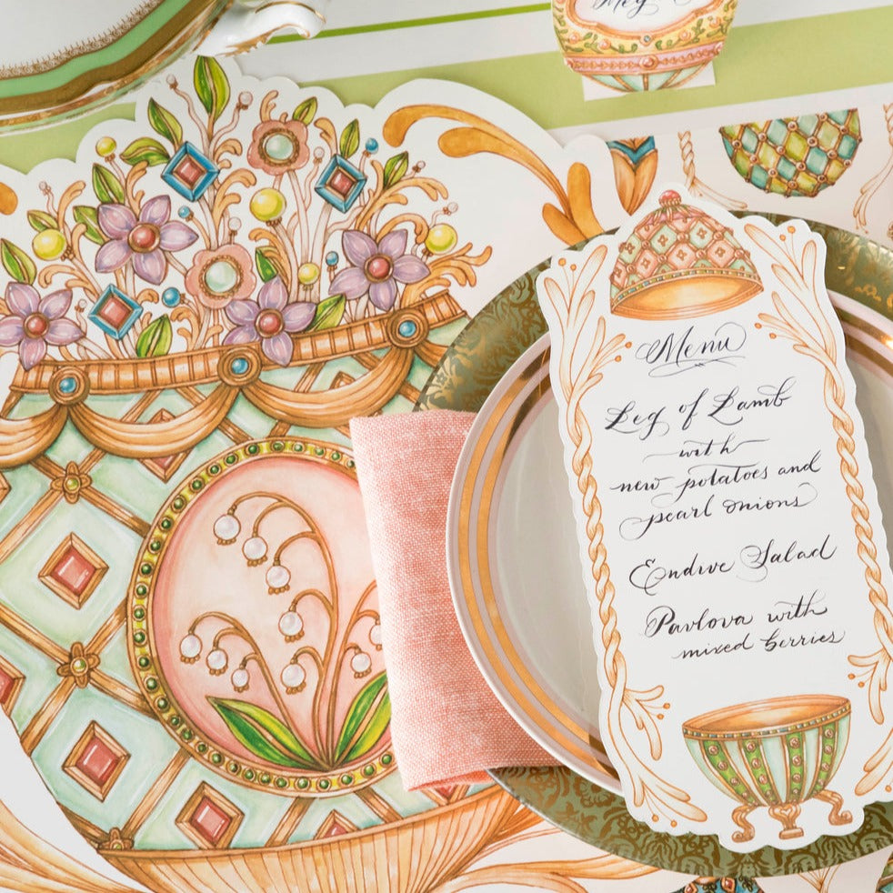 Close-up of the Die-cut Exquisite Egg Placemat under an elegant Easter place setting, showing the artwork in detail.