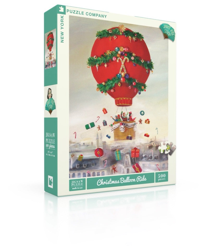 The Christmas Balloon Ride puzzle box on a white table. 