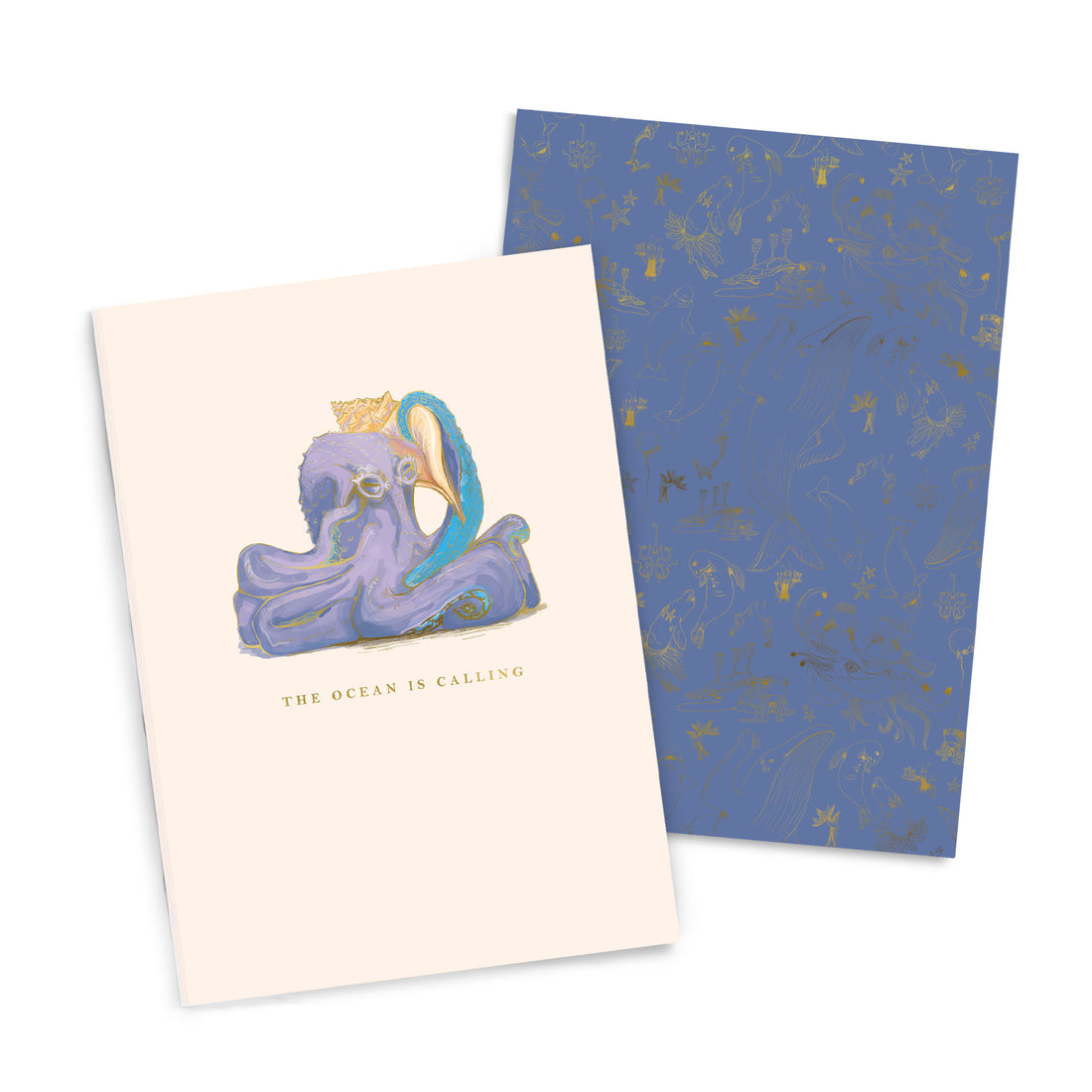 A Good Juju Ink Ocean is Calling Notebook Duo with an illustration of an octopus wearing a crown and the phrase "the ocean is calling" on its cover, beside a patterned blue sheet.