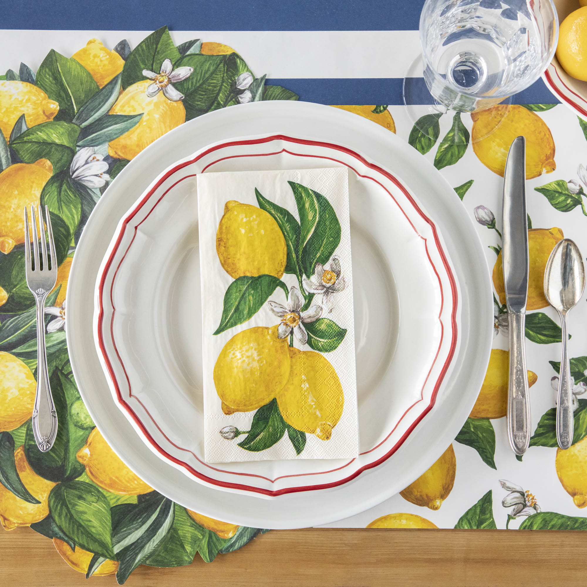 A vibrant table setting with Hester & Cook lemon napkins on it, perfect for any occasion.