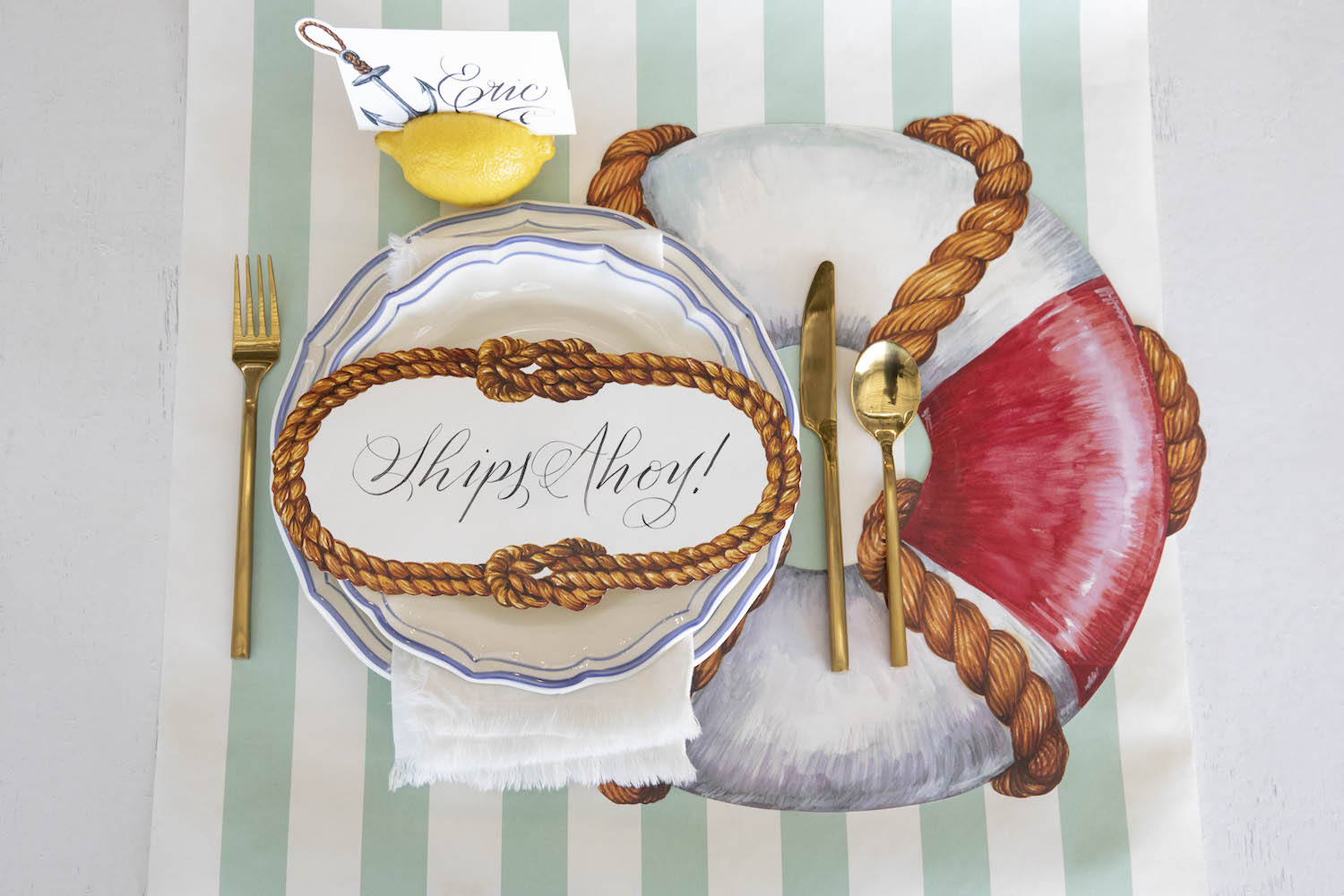 Top-down view of a nautical place setting featuring a Sailors&