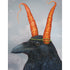 A cloudy gray greeting card featuring a charming illustration of a black raven wearing two carrots on its head like ears. 