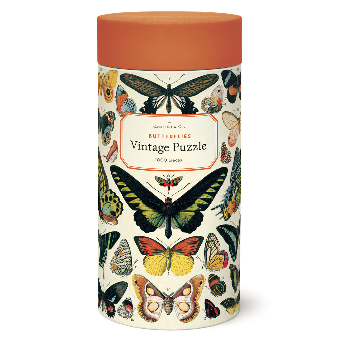 A tin of vintage puzzles with a Cavallini Papers & Co 1000 piece Butterflies Puzzle on it.