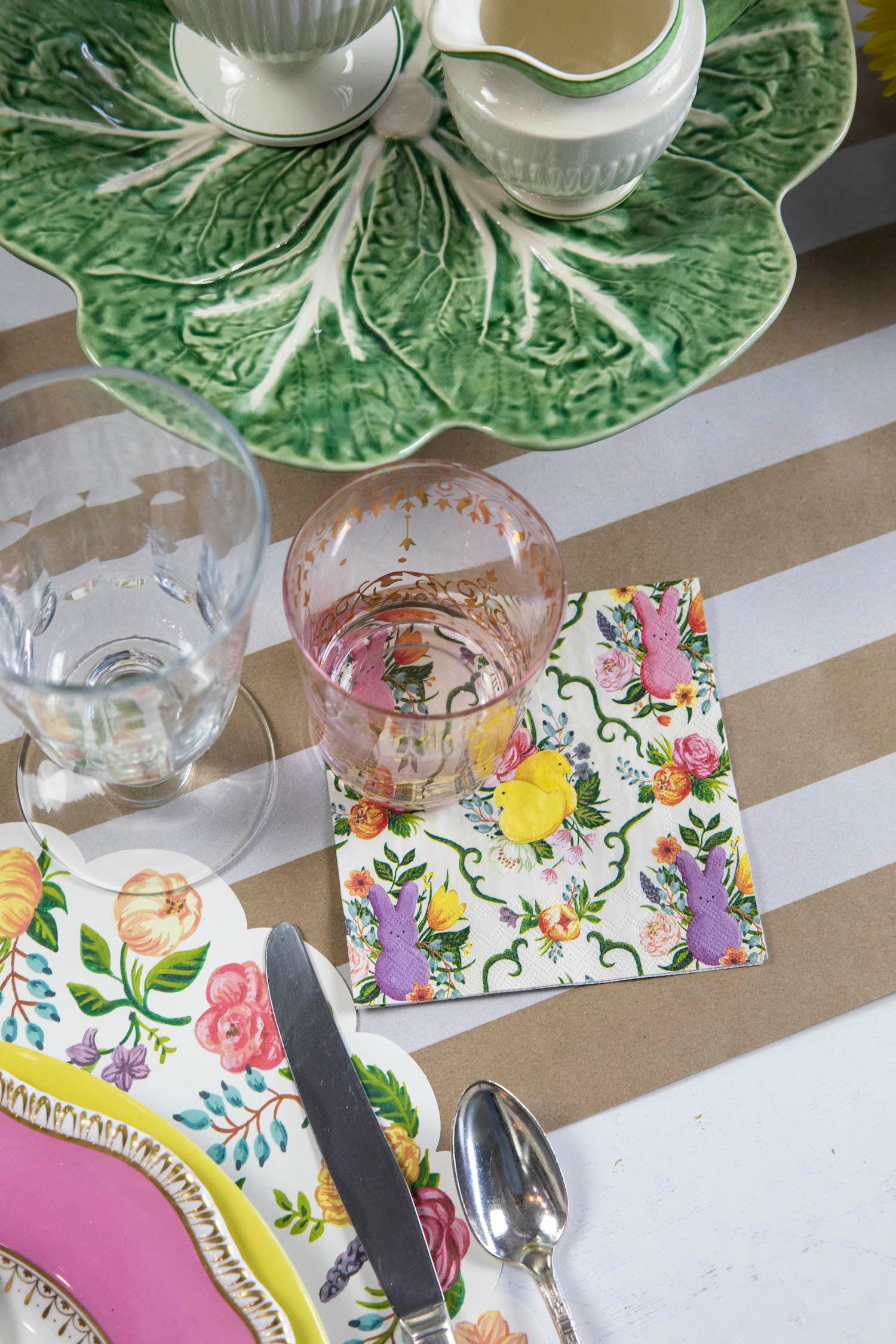 A PEEPS® Cocktail Napkin under the water glass of an elegant Easter place setting.