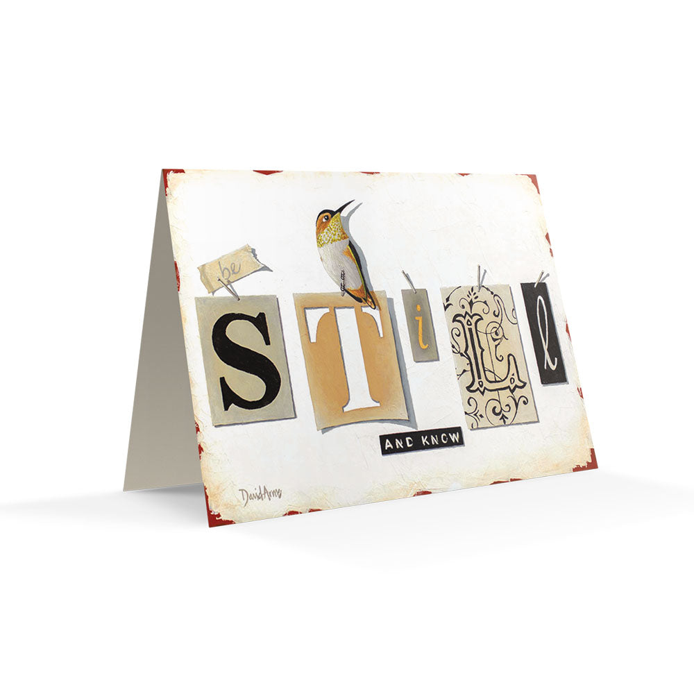 Handcrafted "Be Still & Know" (Tags) notecard of a hummingbird perched on the word "style" written in unique typography on textured paper, accompanied by art tools on a worn surface by David Arms.