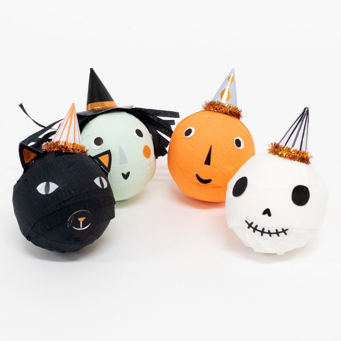 Four surprise balls; a witch, skull, black cat and pumpkin, all with charming little hats with copper foil detail.