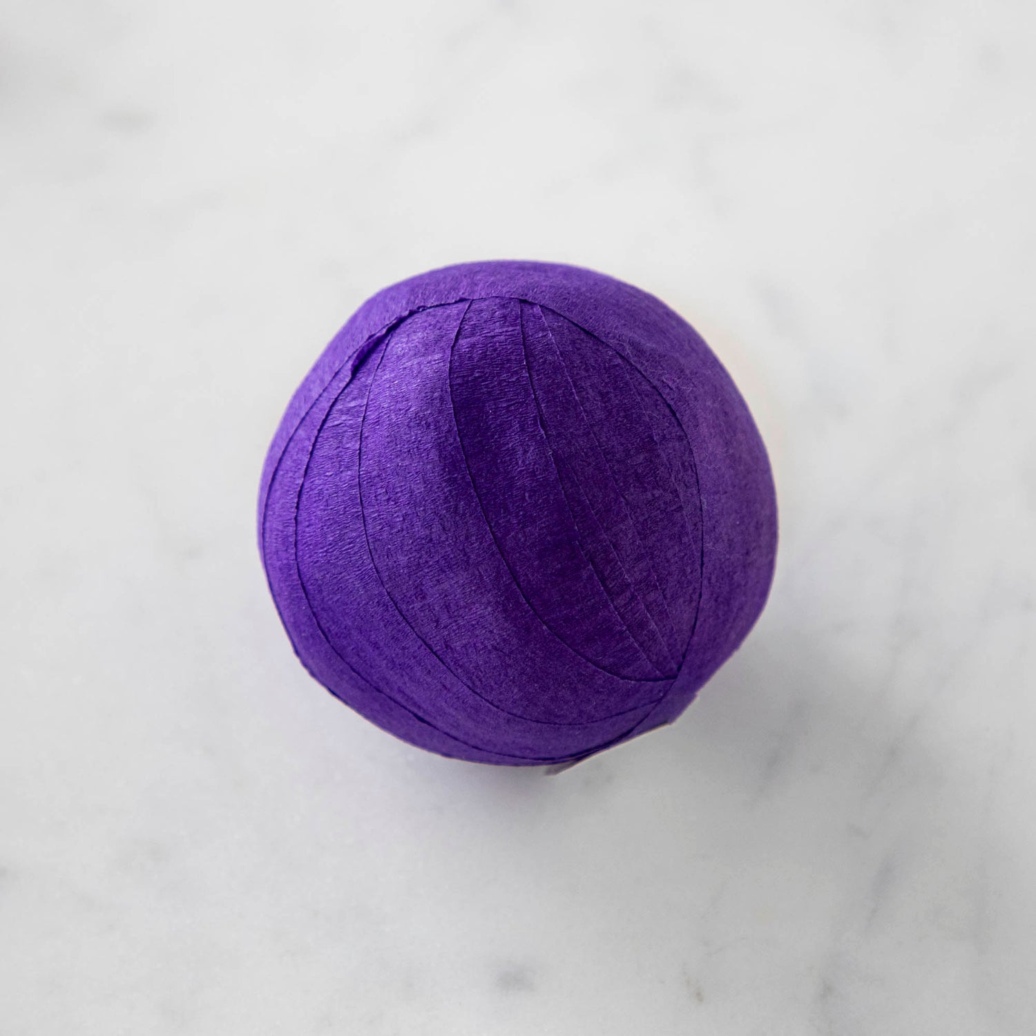 Vintage-inspired Mini Surprize Balls in a white bowl with confetti by Tops Malibu.