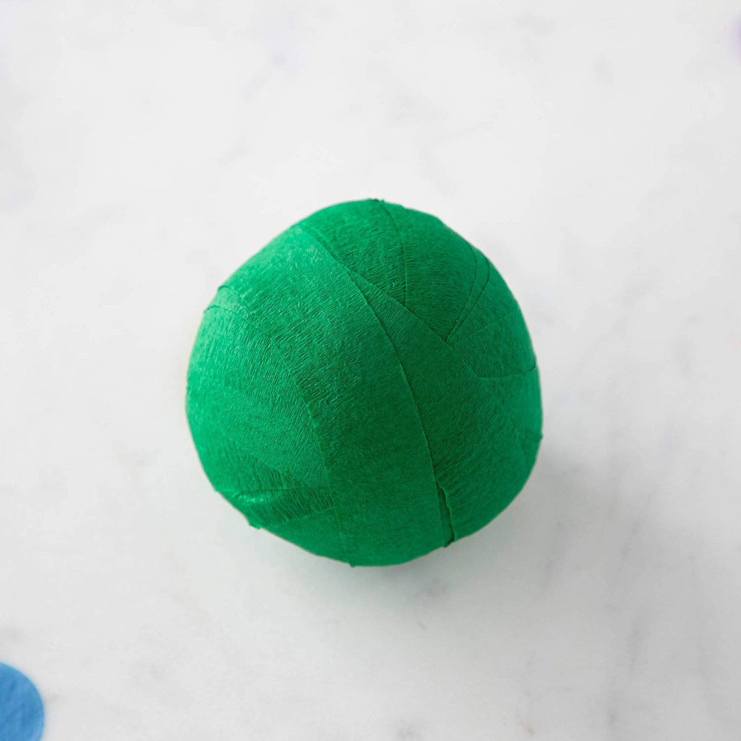 Vintage-inspired Mini Surprize Balls in a white bowl with confetti by Tops Malibu.