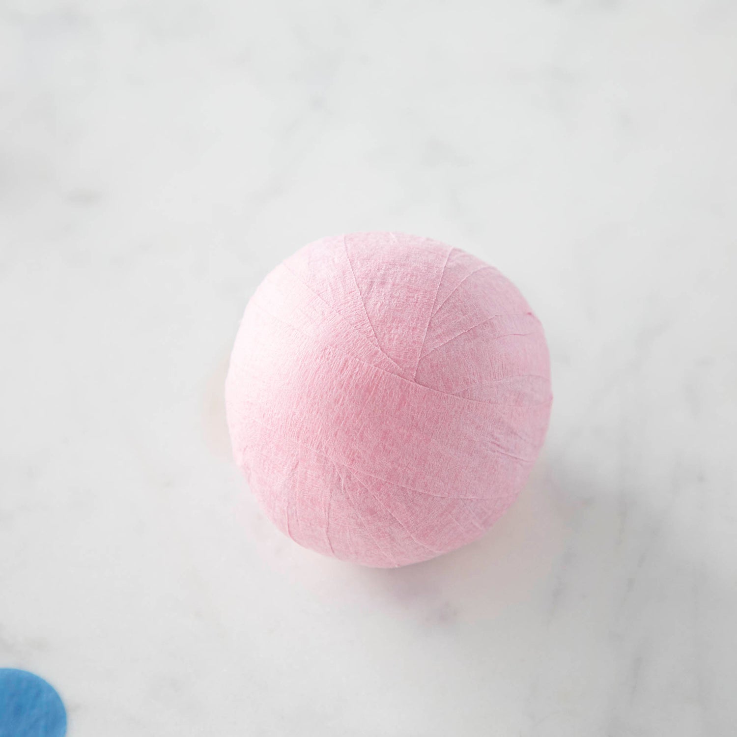 Vintage-inspired Mini Surprize Balls in a white bowl with confetti by Tops Malibu.