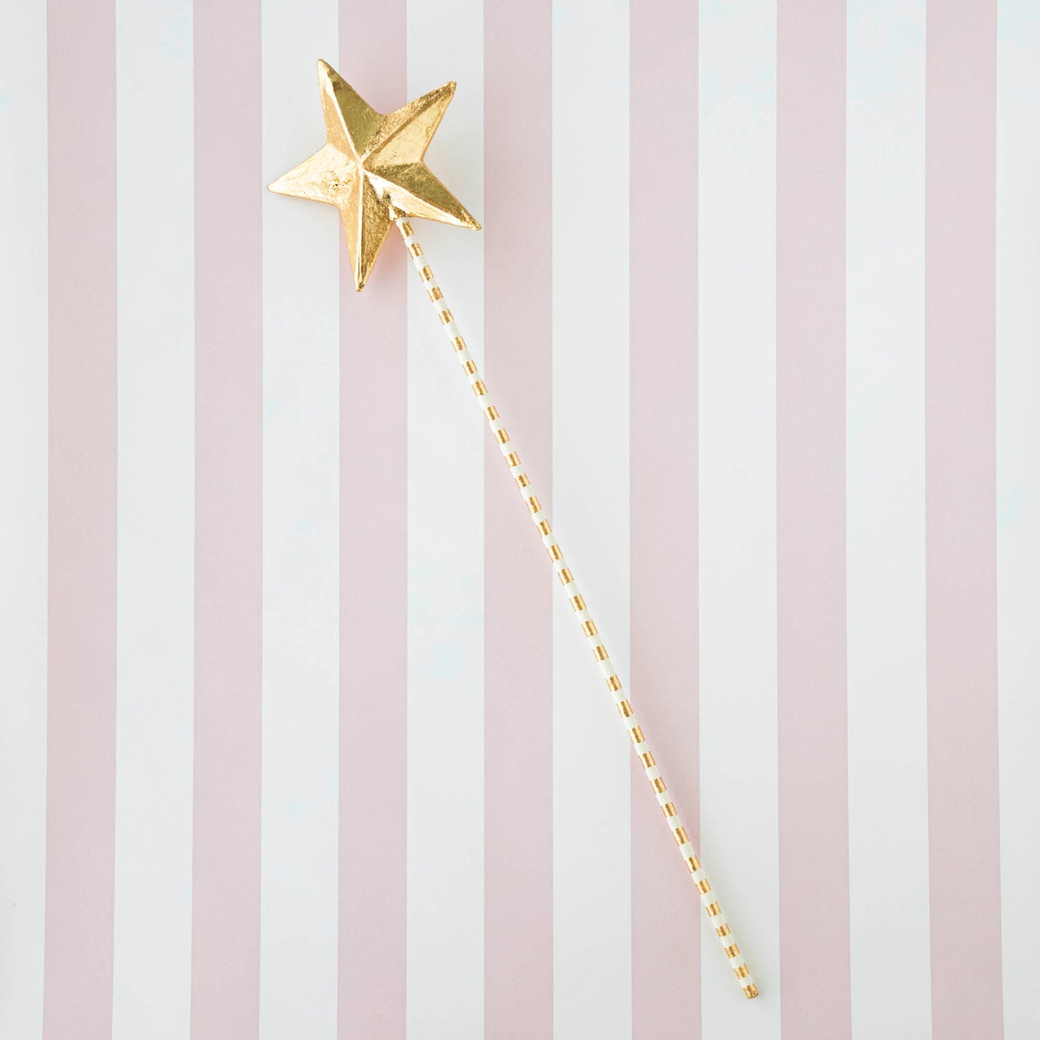 Five Glitterville Magic Wands on a striped background.