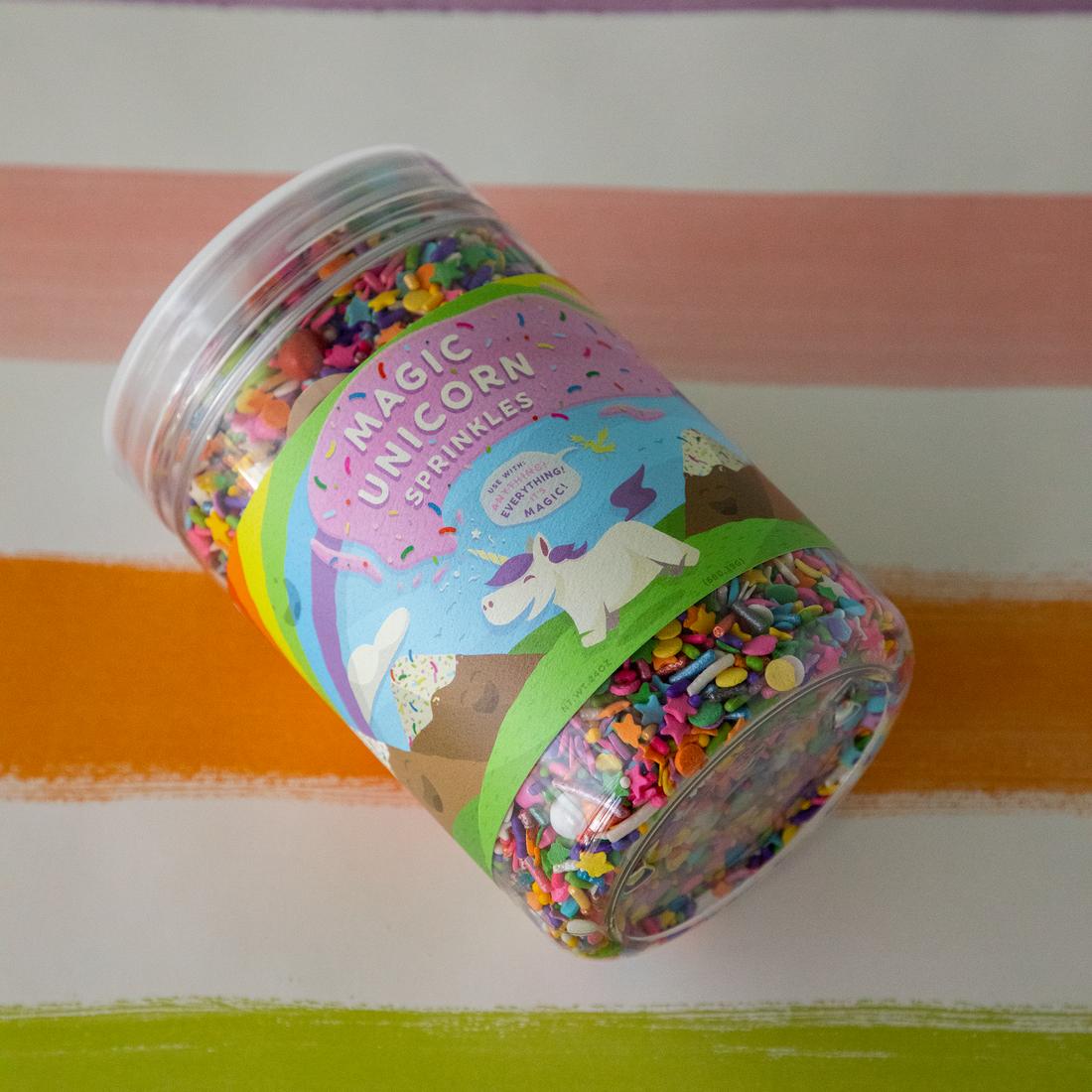 A 24oz bottle of Magic Unicorn Sprinkles on the Sorbet Painted Stripe Runner.