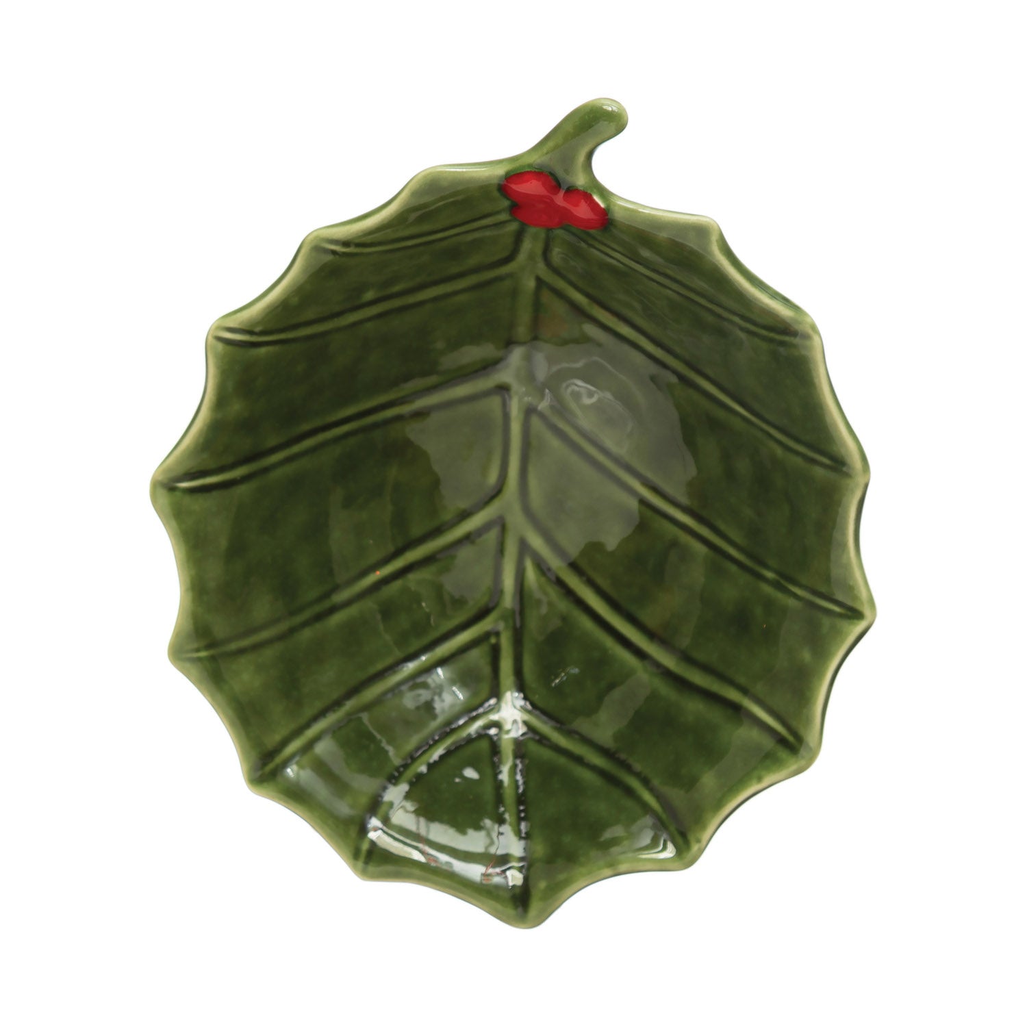 A green stoneware bowl with a holly leaf pattern.
