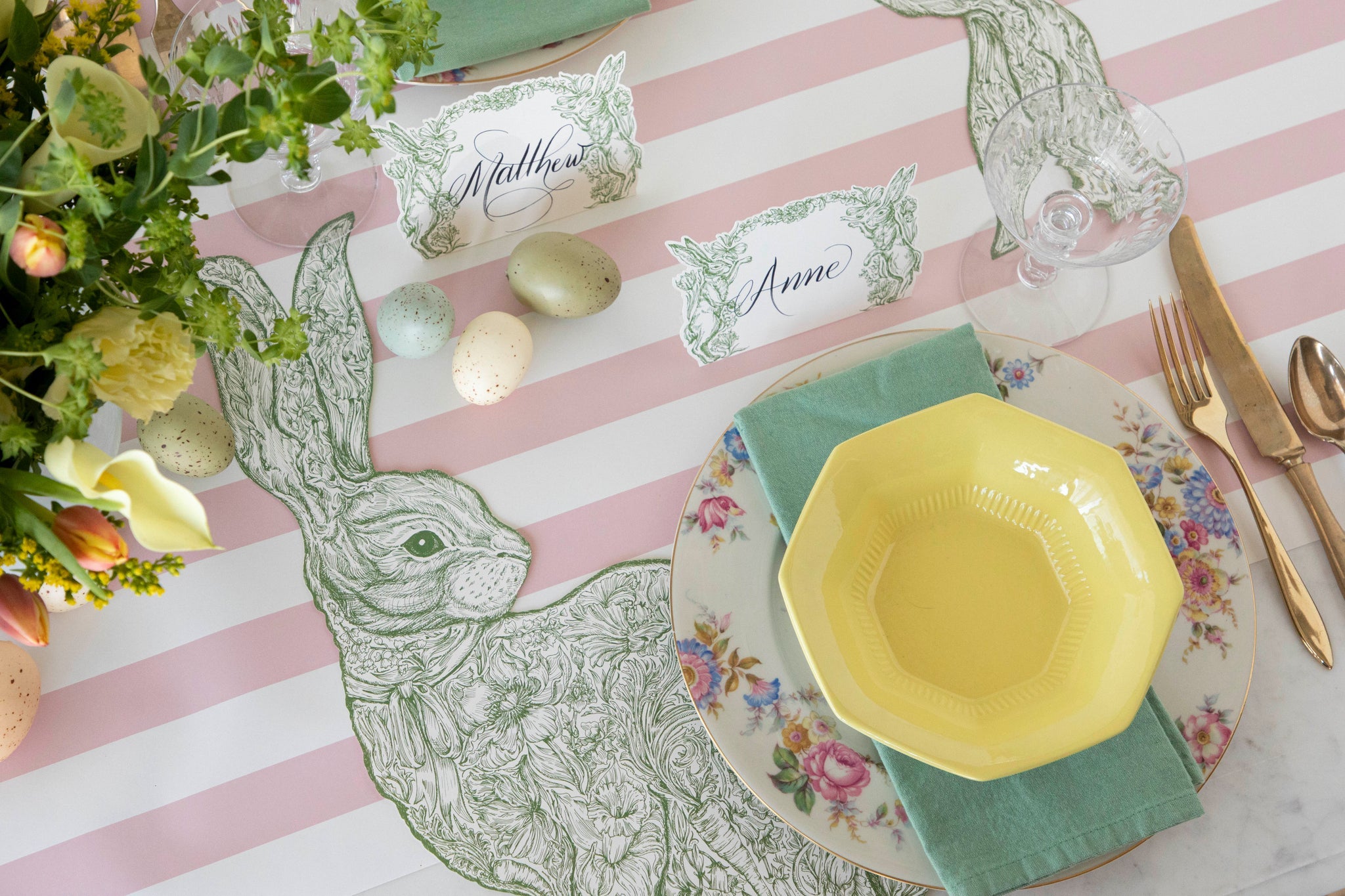 Die-cut Greenhouse Hare Placemat styled on a spring table setting.
