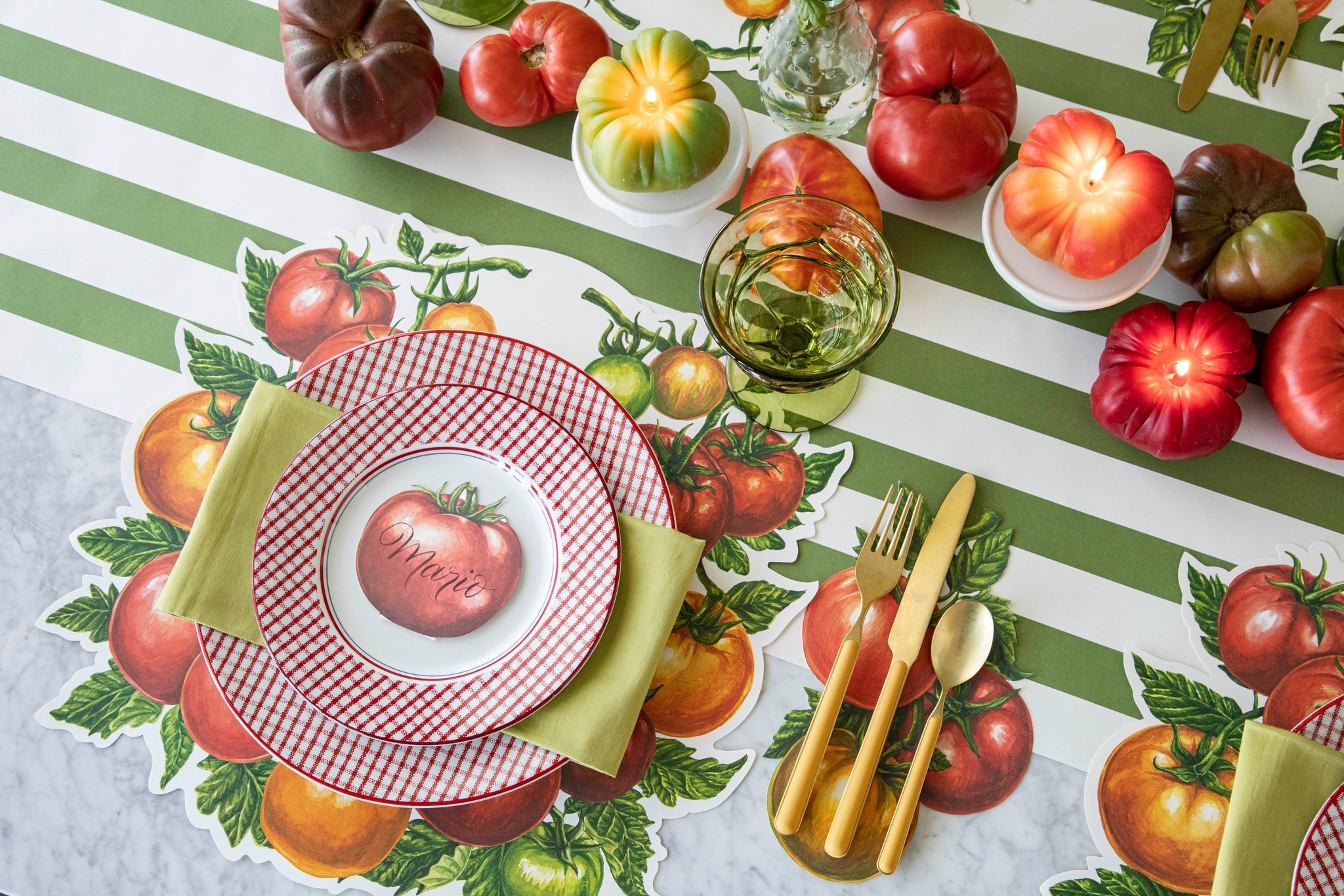 Tomato Story products styled on a picnic themed table setting.