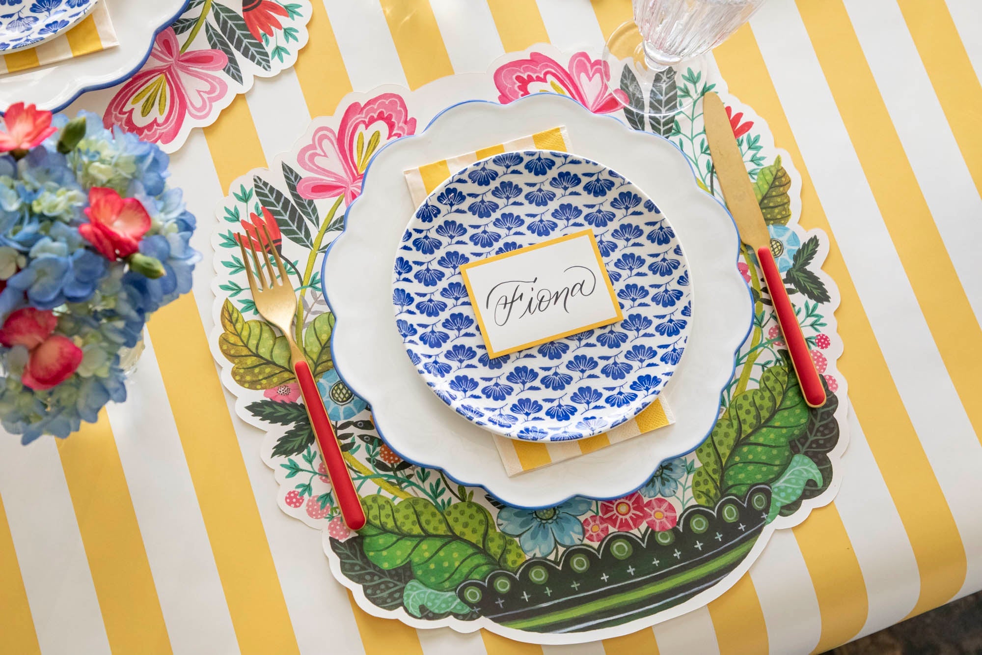 A spring table setting featuring the Die-cut Vase Arrangement Placemat with artwork by Elizabeth Foster.