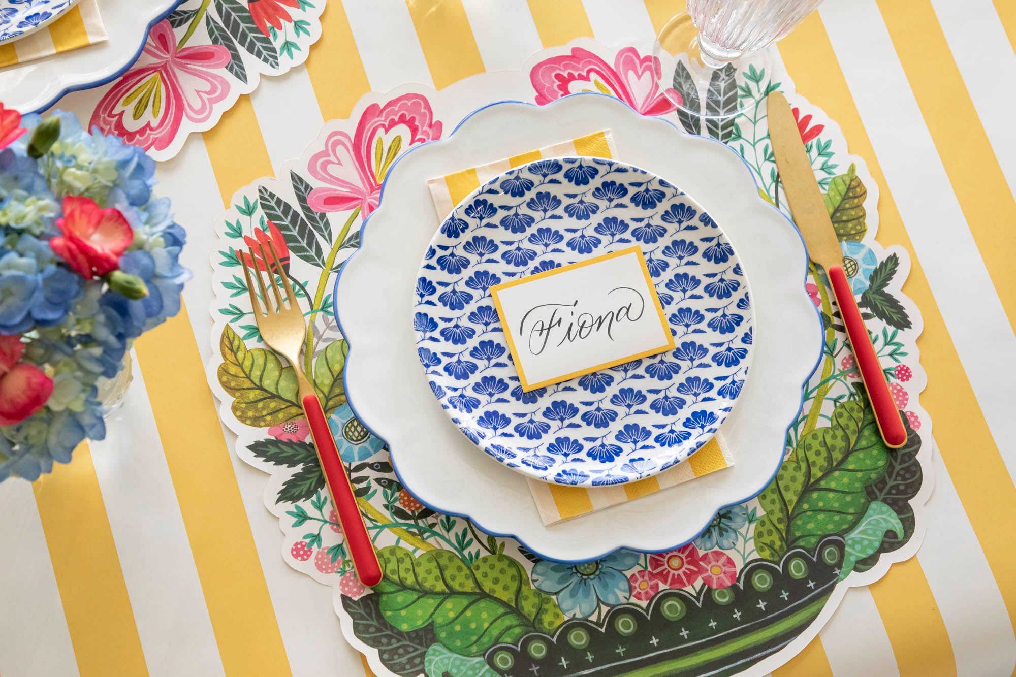 Vibrant Vases Story products styled on a brightly colored place setting.