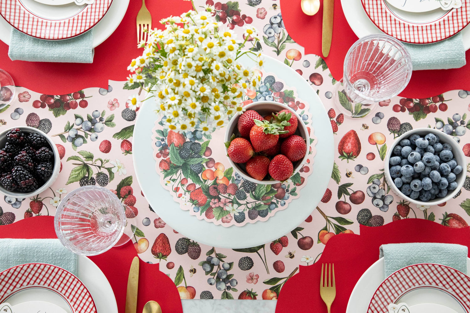 Wild Berry Runner under a table setting featuring assorted fruit.