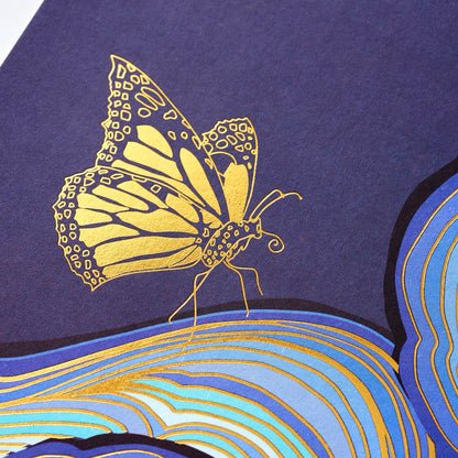 The Butterfly Effect card set featuring blue artwork with a gold butterfly on it. 
