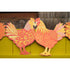 Close up of colorful red & orange hued chicken garland. 