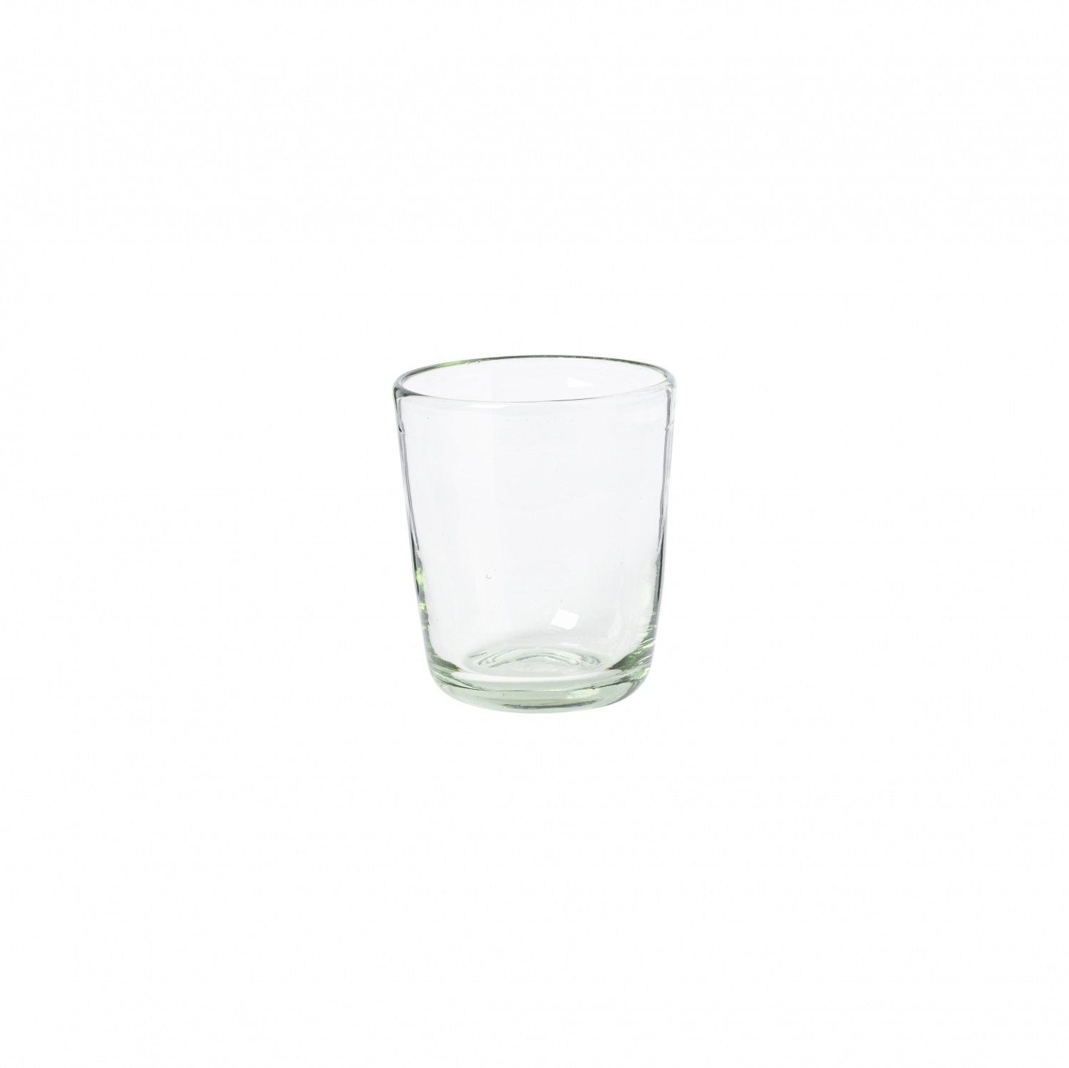Three empty Margarida Recycled Glasses vessels of varying heights and shapes, made by Casafina Living, rest on a white surface.