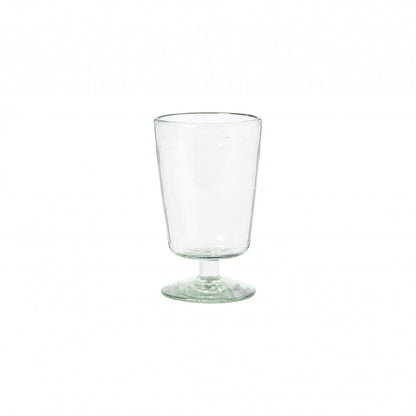Three empty Margarida Recycled Glasses vessels of varying heights and shapes, made by Casafina Living, rest on a white surface.