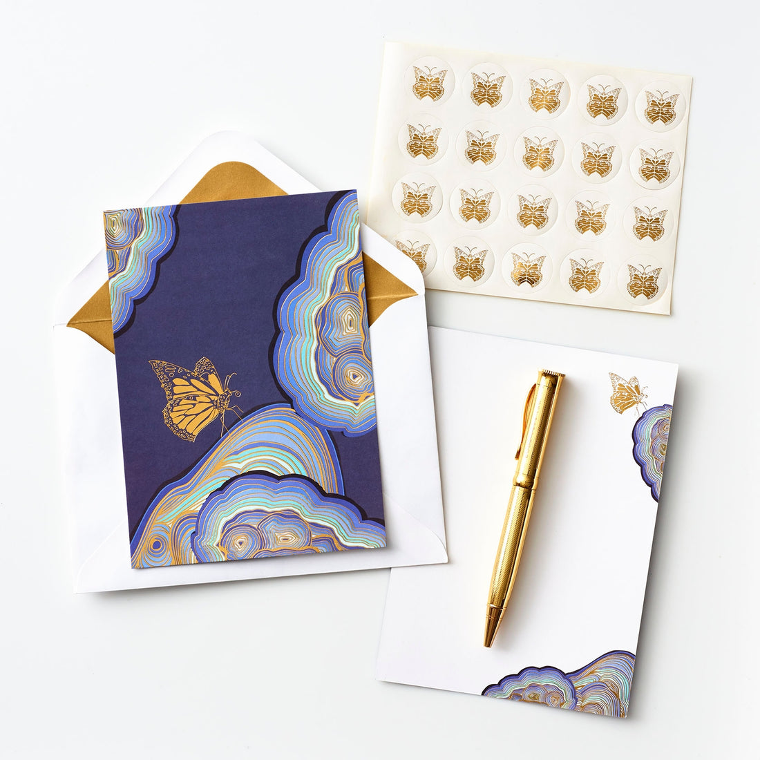 The Butterfly Effect card set featuring blue artwork with a gold butterfly on it. 