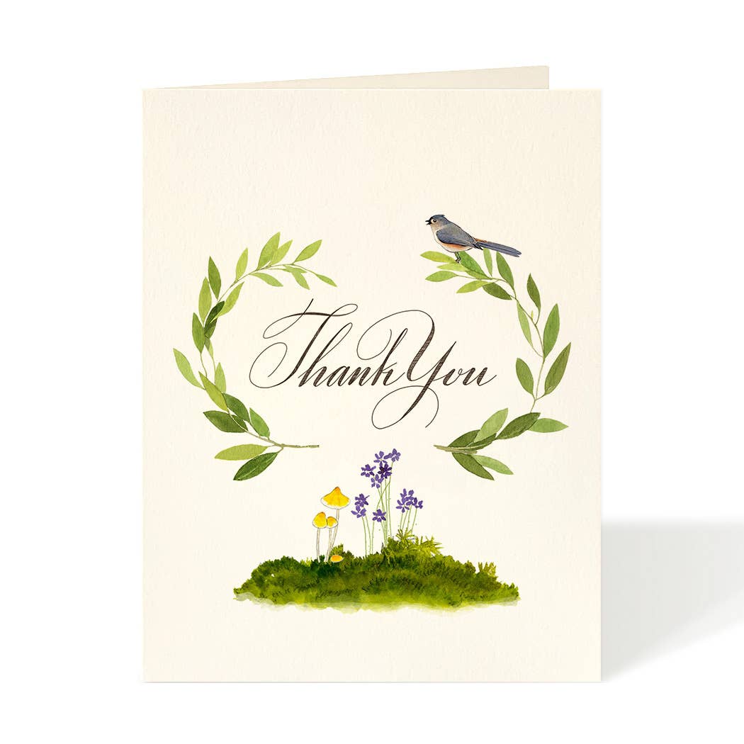 Greeting card by Felix Doolittle featuring artwork of a laurel wreath with a bird resting on it and small clump of flowers and mushrooms below.  