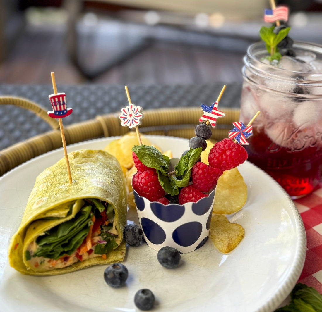 Patriotic Cocktail &amp; Appetizer Picks in 5 assorted styles including a firework, a star with a flag on it, a pinwheel, a top hat and an American flag in fruit and a sandwich and a cocktail.