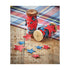 Red and blue stars made of paper sewn onto a string wrapped around a wood spool.