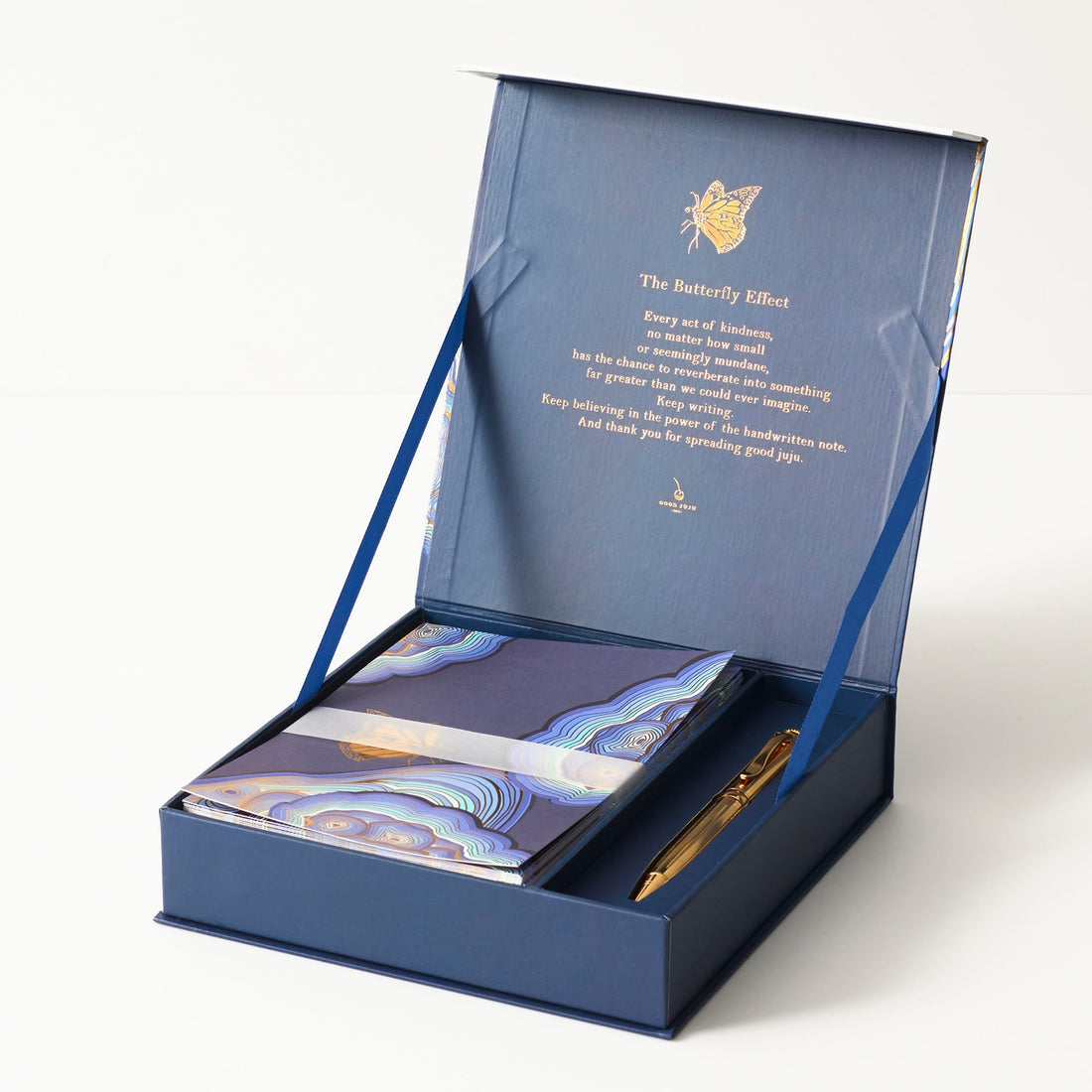 The Butterfly Effect card set featuring blue artwork with a gold butterfly on it. 