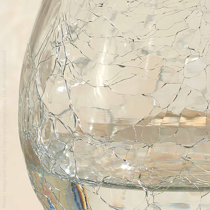 A glass of wine on a table next to Norwell Goblets by Design Ideas.