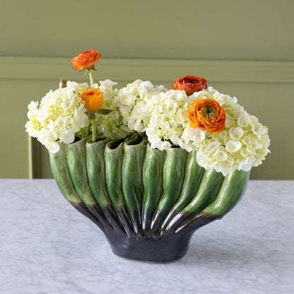 10-hole Ceramic Fakir Green Vase with flowers in it.