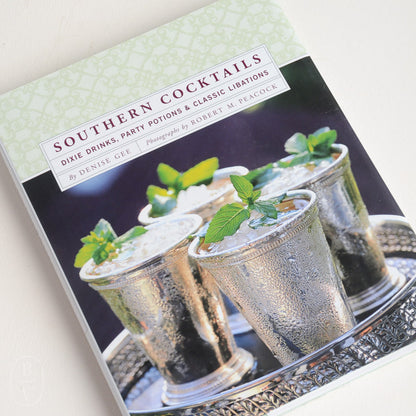 A Chronicle Books book cover titled &quot;Southern Cocktails&quot; featuring an image of four mint julep drinks on a silver tray, perfectly capturing the spirit of cocktail hour.