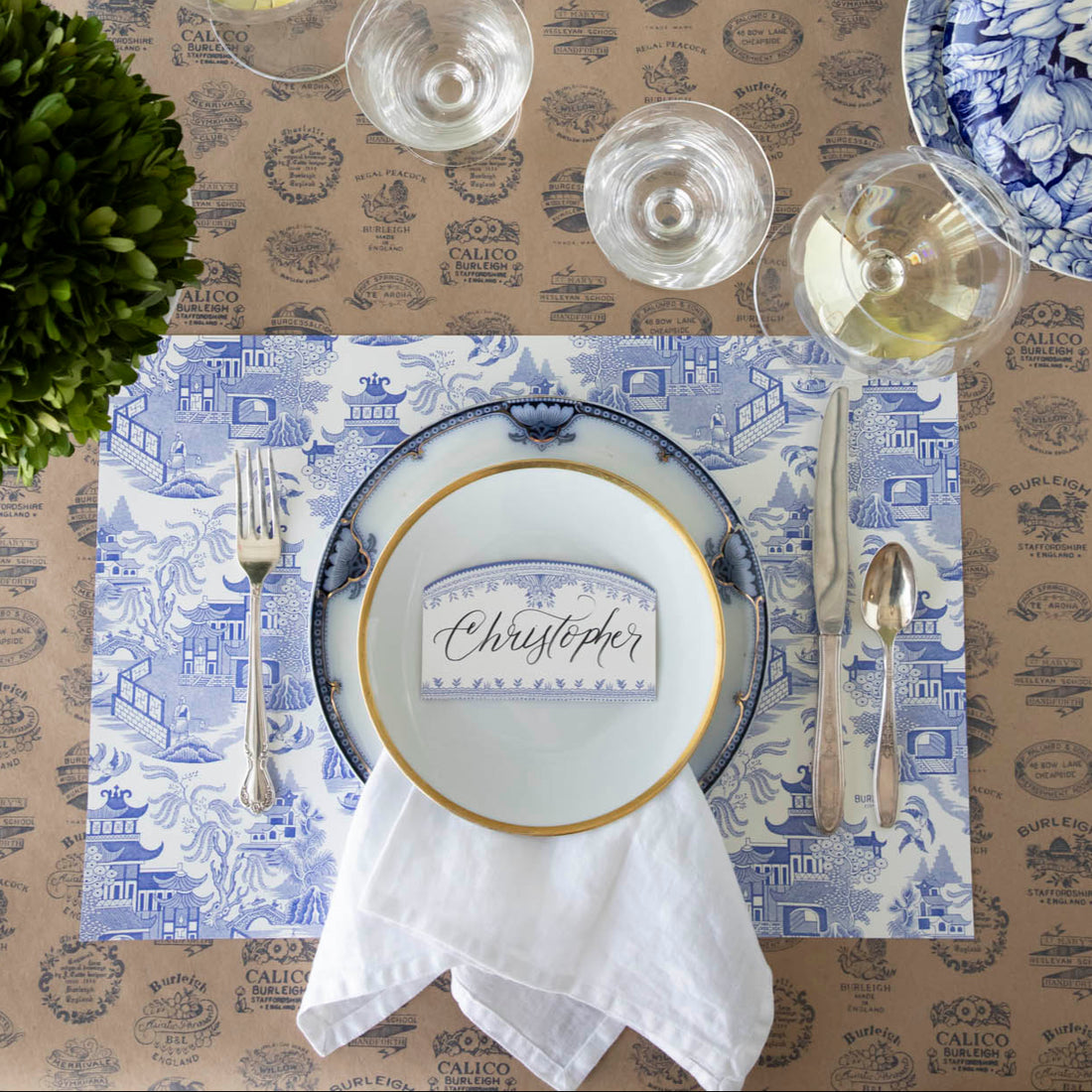 Blue Willow Classic Placemat with the Kraft Burleigh Heritage Runner underneath, styled elegantly with a place setting for one.