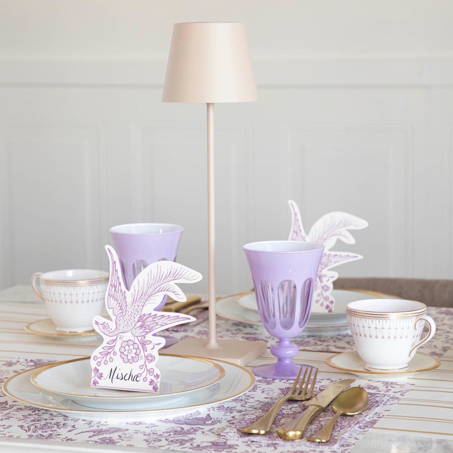 A Sand Cordless Lamp by Zafferano on a table.