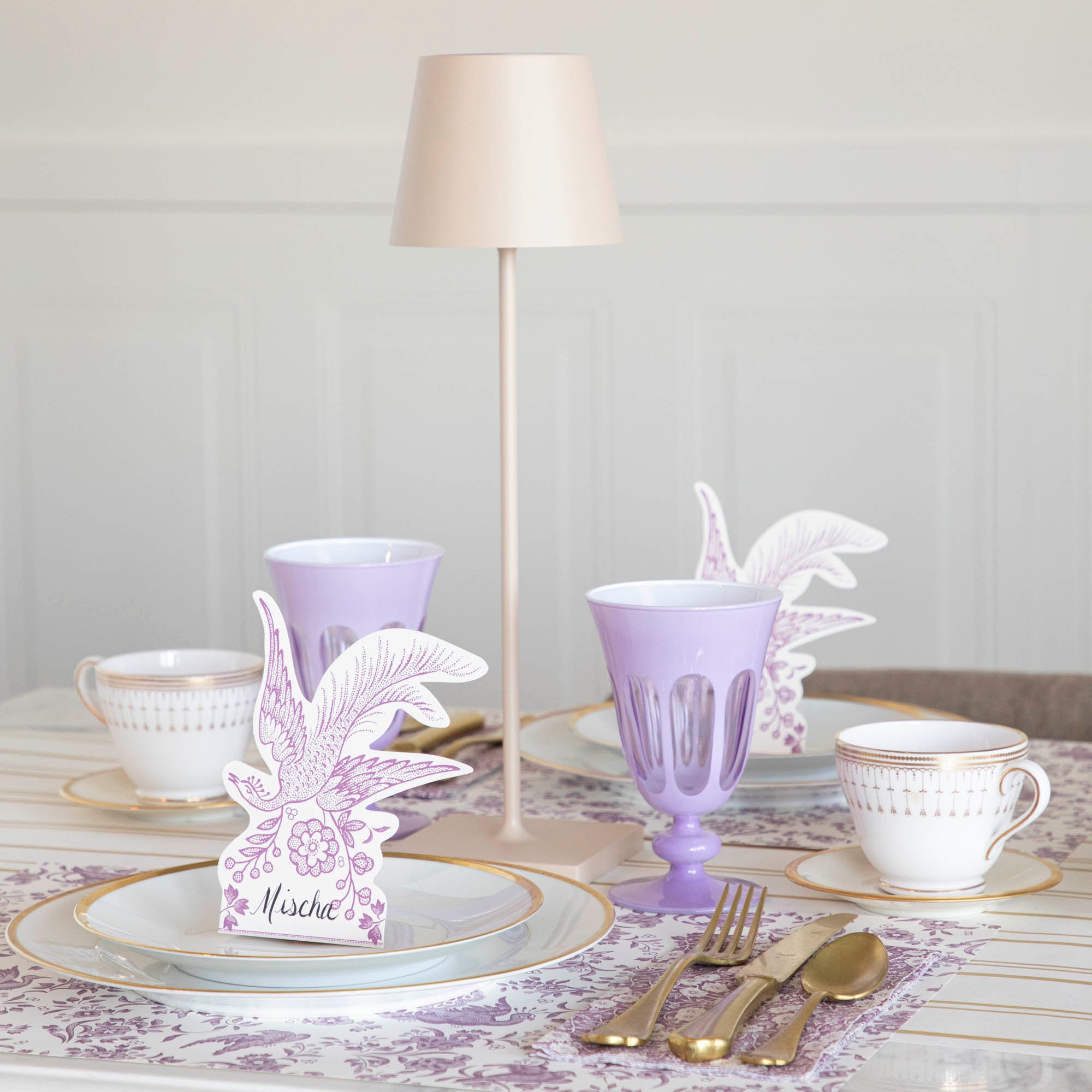 A Sand Cordless Lamp by Zafferano on a table.