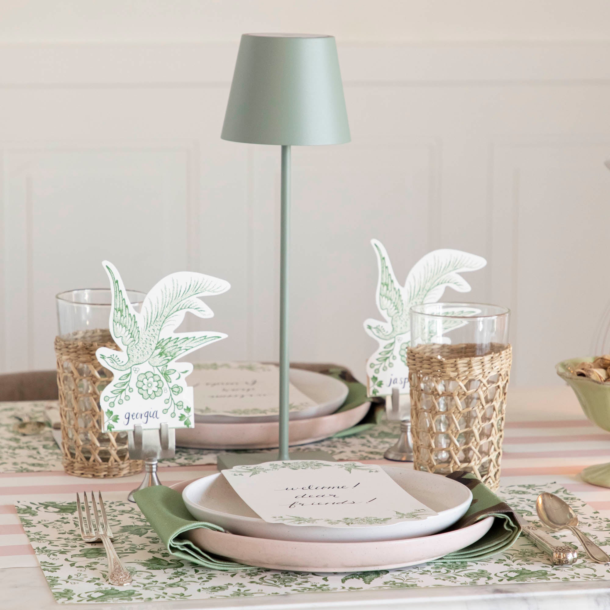 A table setting with place settings and a Zafferano Sage Cordless Lamp.